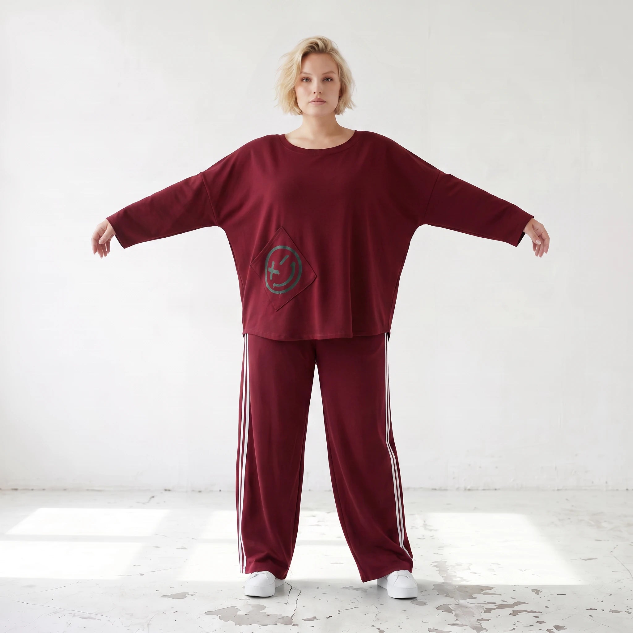 Rote Ballonhose aus French Terry mit Kontraststreifen und elastischem Bund Streetwear