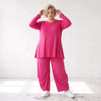 Pinkes Langarmshirt in Glockenform aus softer Slinkyqualität mit Rundhalsausschnitt