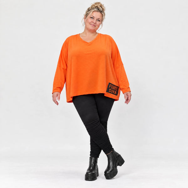 Langarmshirt in kräftigem Orange mit lässig kastigem Schnitt aus weichem Baumwolljersey
