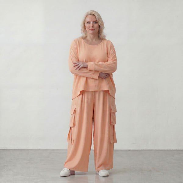Legere Oversize Ballonhose in fliessendem Mauve mit Lagenlook und Fransen Details Trend