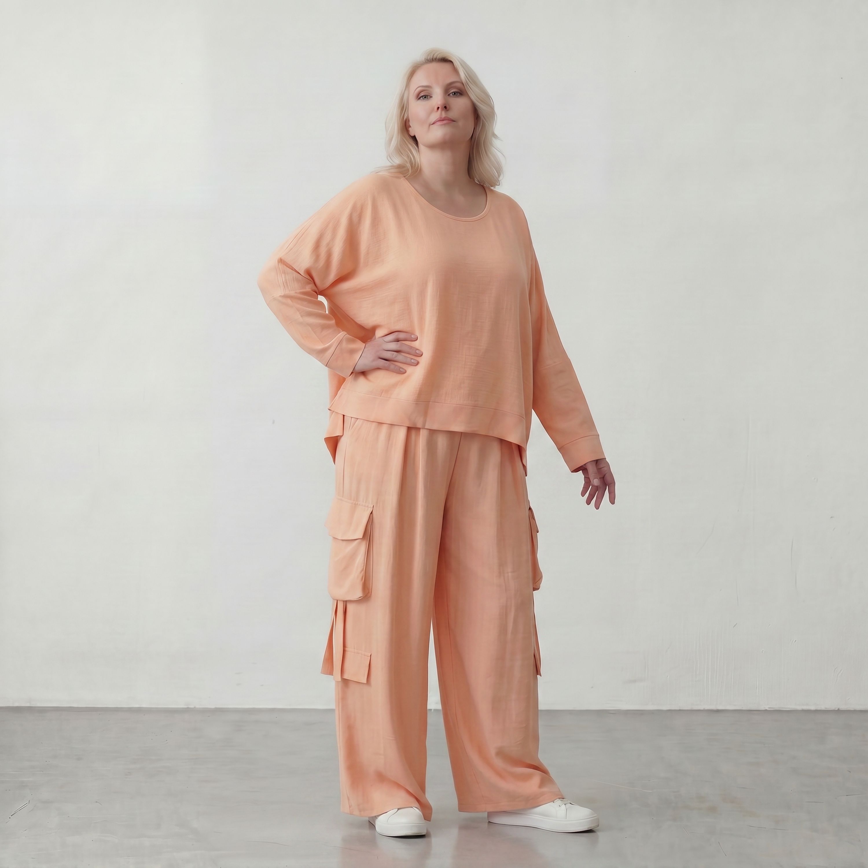 Legere Oversize Ballonhose in fliessendem Mauve mit Lagenlook und Fransen Details Trend